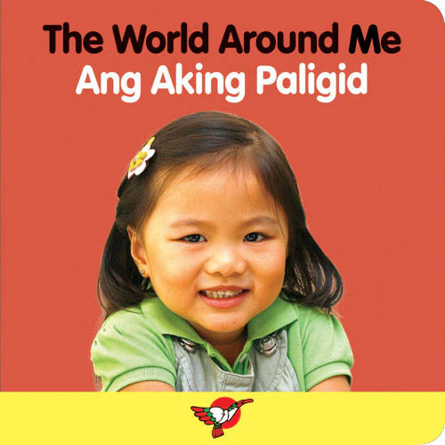 Cover of The World Around Me board book showing a photograph of a smiling toddler girl against a coral red background