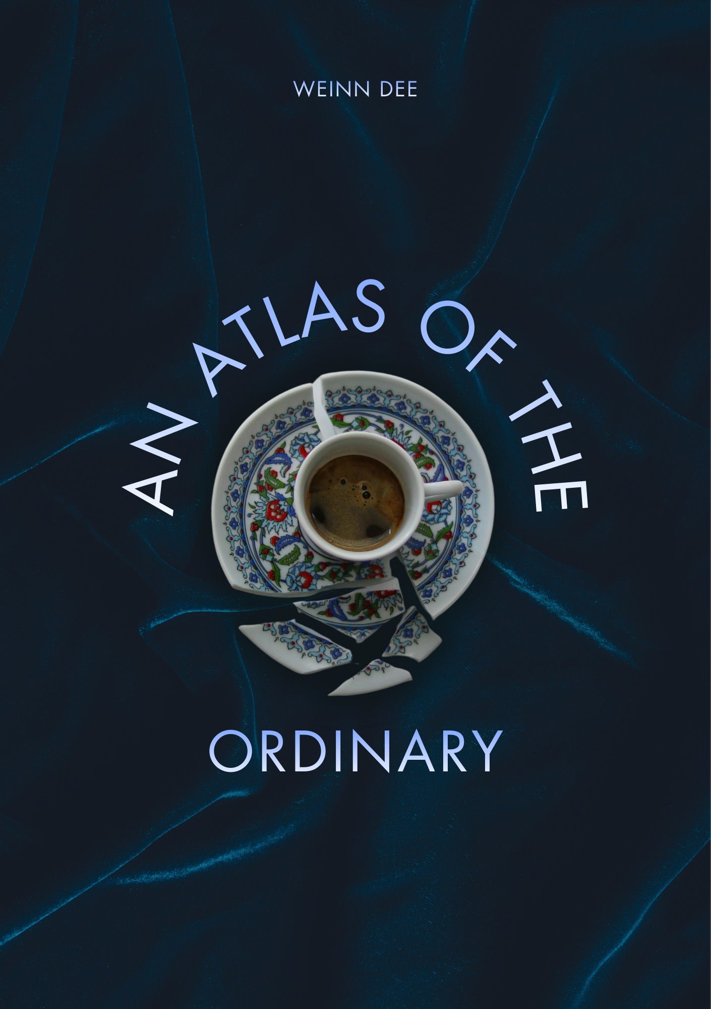 Cover of An Atlas of the Ordinary by Weinn Dee showing a cracked porcelain coffee cup and saucer on a dark blue marbled background